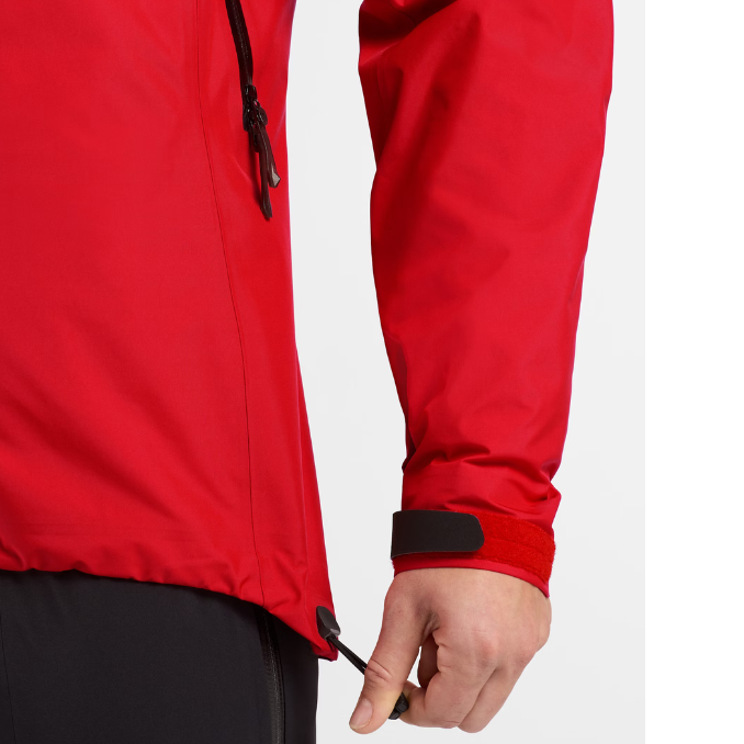 Close view of the Arc'teryx Women’s Alpine Guide Jacket showing the women’s cuff Velcro straps and hem tightening adjustments with GORE TEX PRO construction available on sale in the Arc'teryx collection.