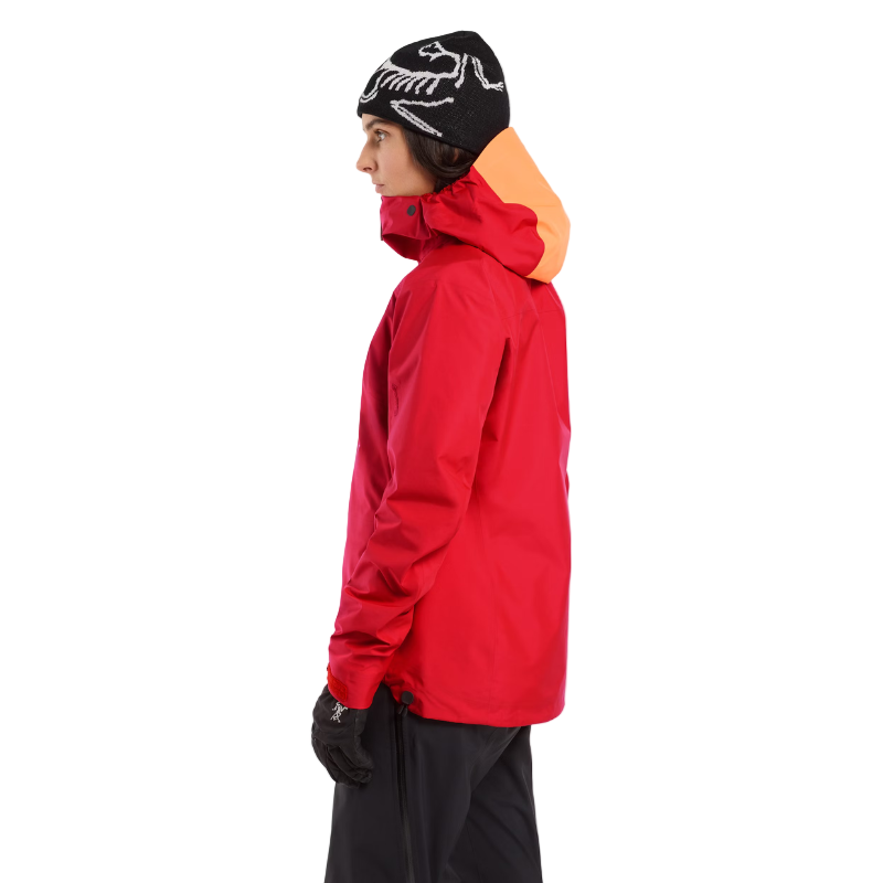 Alternate side view of a person wearing the Arc'teryx Women’s Alpine Guide Jacket showing the women’s GORE TEX PRO alpine shell on sale in the Arc'teryx collection.
