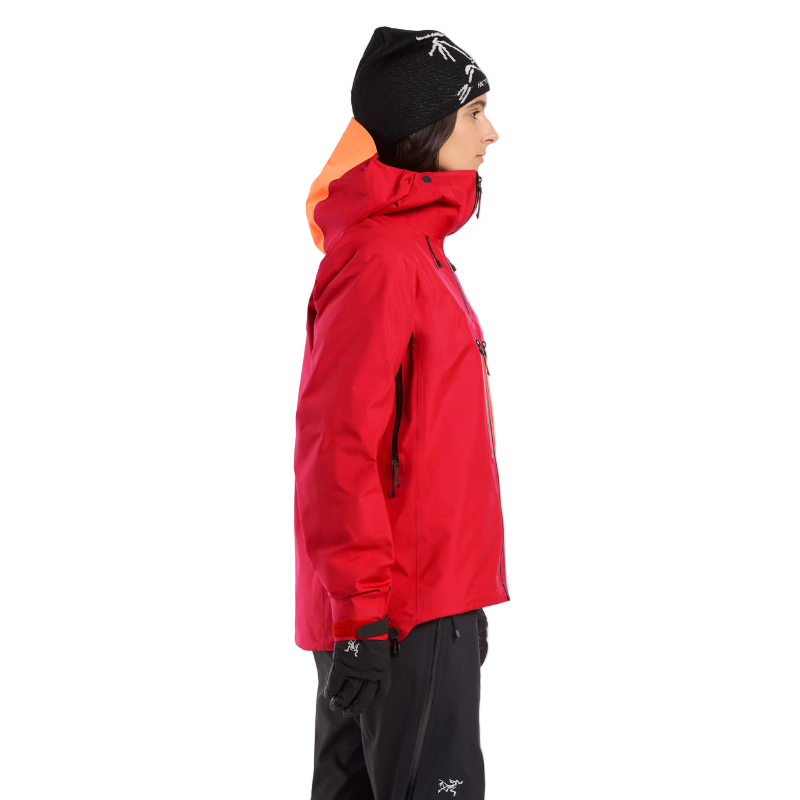 Side view of a person wearing the Arc'teryx Women’s Alpine Guide Jacket showing the women’s technical GORE TEX PRO alpine shell in use and available on sale in the Arc'teryx collection.