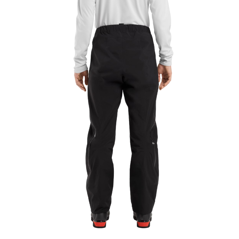 Back view of the Arc'teryx Women’s Alpine Guide Pant being worn showing the women’s fitted GORE TEX PRO ski guide shell design built for alpine pros and featured in the Arc'teryx on sale winter collection.