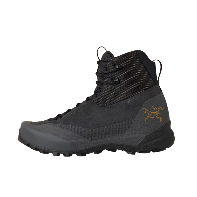 A single Arc'teryx high-top hiking boot in dark gray and black, featuring a gold Arc'teryx logo on the side, set against a plain white background.