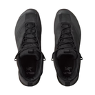 A pair of black Arc'teryx mid-top lace-up shoes shown from a top-down view against a plain white background.