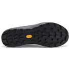 A close-up view of a black shoe sole with a textured tread pattern and a small yellow Vibram logo in the center, set against a plain white background.