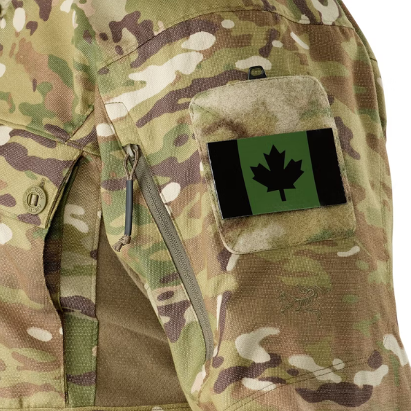 Detailed image of Arc'teryx LEAF Recce Shirt LT sleeve with loop panel for ID patches and visible Arc'teryx logo branding on MultiCam tactical shirt fabric Arcteryx Combat Shirt on Sale