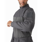 Close-up of the Arc’teryx PRO Assault Combat Shirt sleeve showing upper arm zip pocket, Velcro® panel with V-Lite™ retention ring, and reinforced articulated construction. Built from no melt/no drip NYCO Cordura® ripstop and Cyberknit jersey for tactical use under body armor.