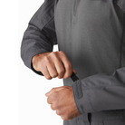 Close-up of the Arc’teryx PRO Assault Combat Shirt sleeve cuff showing Velcro® cinch closure for a secure, adjustable fit. Built with no melt/no drip NYCO Cordura® ripstop and Cyberknit jersey, this combat shirt is PPE-compatible and designed for tactical mobility under body armor.