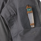 Close-up of the Arc’teryx PRO Assault Combat Shirt sleeve showing Velcro® patch panel with V-Lite™ retention ring for IFF devices or ID patches. Tactical combat shirt built with no melt/no drip NYCO Cordura® ripstop and Cyberknit jersey, designed for use under body armor in direct action missions.