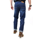Person wearing blue jeans on a white background