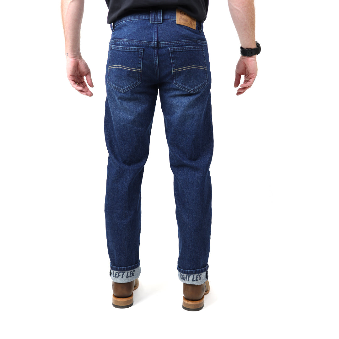 Person wearing blue jeans on a white background