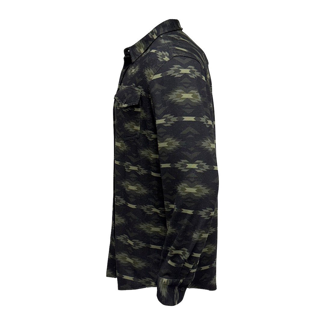 A long-sleeve button-up shirt shown in side profile, featuring a dark aztec pattern with olive green and black tones.