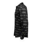 A long-sleeve button-up shirt shown in side profile, featuring a dark aztec pattern with olive green and black tones.