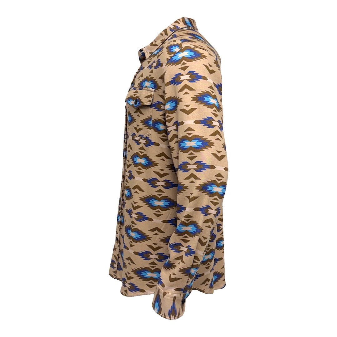 A long-sleeve button-up shirt shown in side profile, featuring a Southwestern geometric pattern in tan, brown, blue, and white on a plain white background.