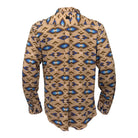 A long-sleeve button-up shirt shown from the back, featuring a tan base with a repeating Southwestern-style geometric pattern in blue, brown, and black.