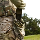 Blue Force Gear Belt Mounted Dump Pouch attached to a battle belt during field use, providing rapid-access storage for magazines and tactical gear.