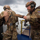 Military personnel using equipment fitted with the Blue Force Gear Ten-Speed Single M4 Mag Pouch during training and operational activities.