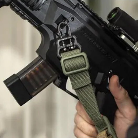 Close-up of a Blue Force Gear ULoop securing a rifle sling to a firearm, highlighting its lightweight design and universal compatibility.