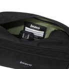 Close-up of the Bravo Co Flee Block I Black interior showing the microfiber-lined compartment and customizable Velcro divider system for camera and gear organization.