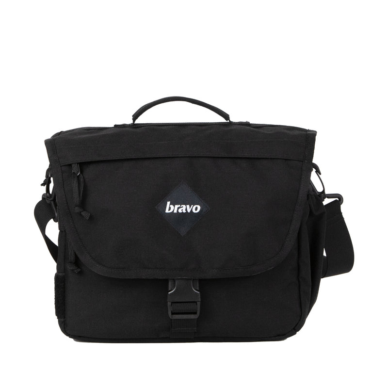 Bravo Co Hull Block 1 tactical duffel bag in Cordura Black featuring a compact design, flap closure, top carry handle, and adjustable shoulder strap.