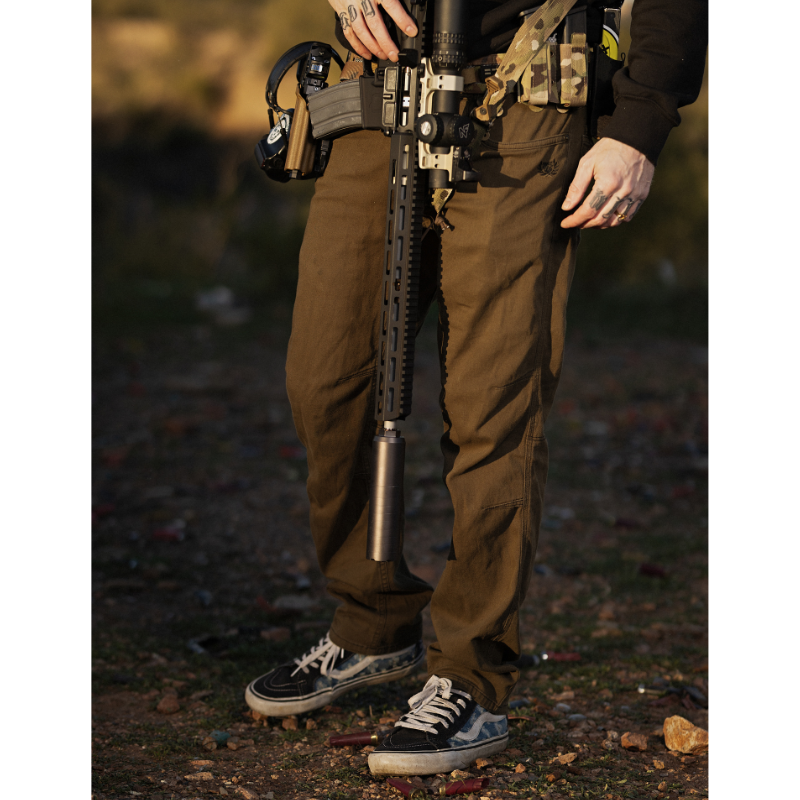 Lifestyle shot focusing on the Carlos Ray Tactical Pants being worn at the range, showing the stretch tactical fabric, accessible mag pockets, reinforced stitching, and EDC ready design ideal for the best tactical pants, CCW use, shooting drills, and high mobility range training.