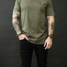 Lifestyle photo of the black Carlos Ray V3 Tactical Pants worn with a T-shirt, demonstrating how the pants blend seamlessly into everyday outfits while still providing full tactical function, discreet EDC storage, and a clean, non-obvious design.