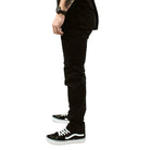 Side product view of the Carlos Ray V3 Tactical Pants in Black shown in Slim Fit, featuring the tapered leg profile, articulated knees, gusseted crotch, and reinforced pocket openings. Built from 4-way stretch twill for unrestricted movement. Also available in Regular Fit for those wanting classic tactical comfort and everyday performance.
