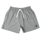 Front view of Cove Charcoal Grey Performance Shorts made from recycled plastic bottles. These 5" inseam athletic shorts feature an elastic waistband with drawstring and zippered side pockets for secure storage. Made with 90% recycled polyester and 10% spandex, they offer comfort and mobility for gym, swim, or lounging.