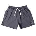 Front view of Cove Grey Gunmetal Performance Shorts made from recycled plastic bottles. Featuring a 5" inseam, elastic waistband with drawstring, and zippered side pockets, these shorts offer comfort, mobility, and secure storage. Made with 90% recycled polyester and 10% spandex, they’re perfect for the gym, swim, or lounging.