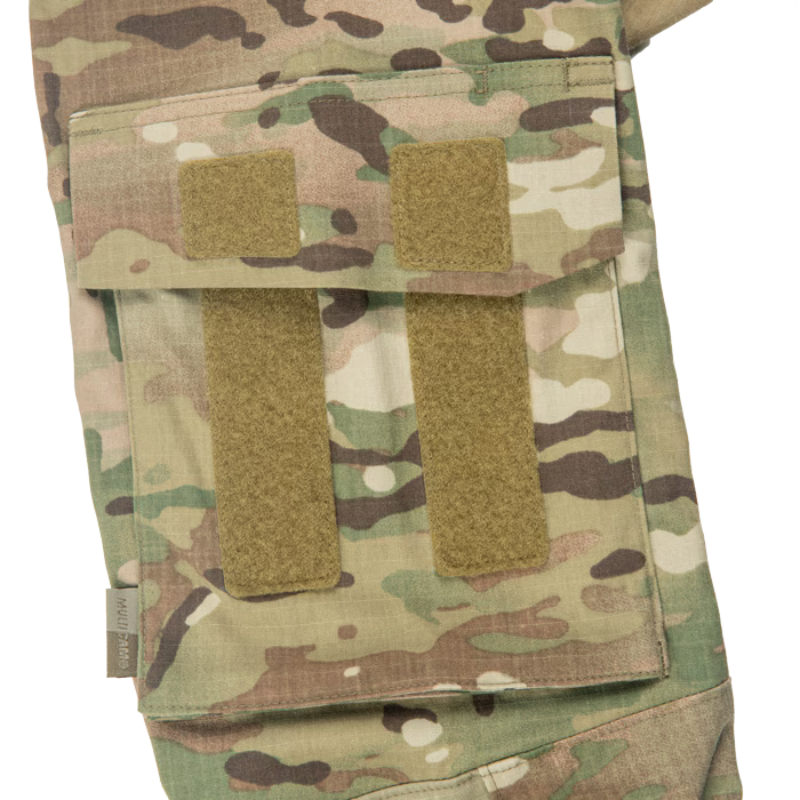 Close-up of the Crye Precision G3.5 Combat Shirt shoulder pocket showing the thermo-bonded flap design and hook-and-loop attachment area.