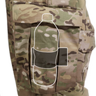 Close view of the Crye Precision G3 Combat Pants showing how a water bottle fits securely inside the cargo pocket using the internal stabilizer band for steady carry during movement.