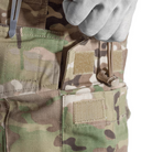 Close view of the Crye Precision G3 Combat Pants cargo pocket showing the internal elastic stabilizer band designed to secure water bottles or magazines during movement.