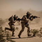 On body action photo of the Crye Precision G3 Combat Pants being worn during combat oriented field operations showing the mobility, durability, and mission driven design in use.