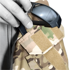 Close up view of the Crye Precision G3 Combat Shirt sleeve pocket showing the dedicated eyewear and pen holder slot integrated into the NYCO ripstop bicep pocket for tactical utility.