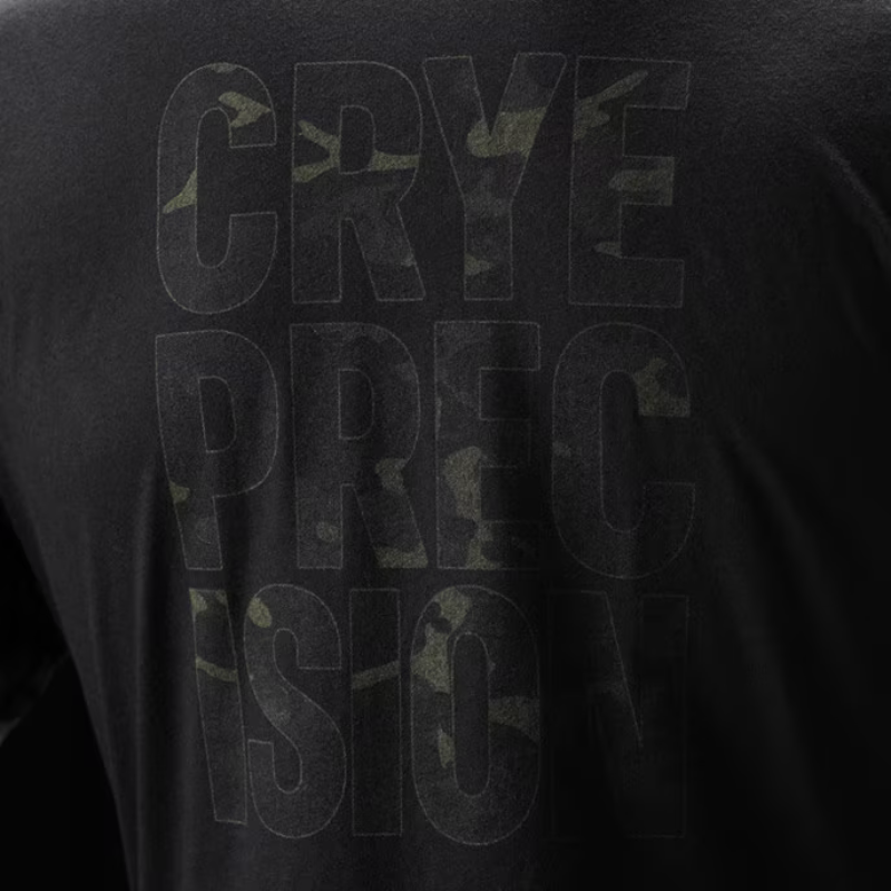 Close-up of a black T-shirt showing the back with large tonal Multicam Black camouflage text reading 'CRYE PRECISION'.