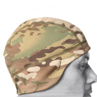 Side profile of Crye Precision SkullCap tactical beanie worn under helmet showing sunglass eyelets and streamlined fleece fit for cold weather operations
