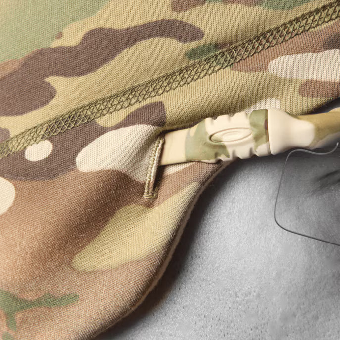 Close up of Crye Precision SkullCap MultiCam tactical beanie showing integrated sunglass eyelet slot for eyewear arm insertion and helmet compatible cold weather use