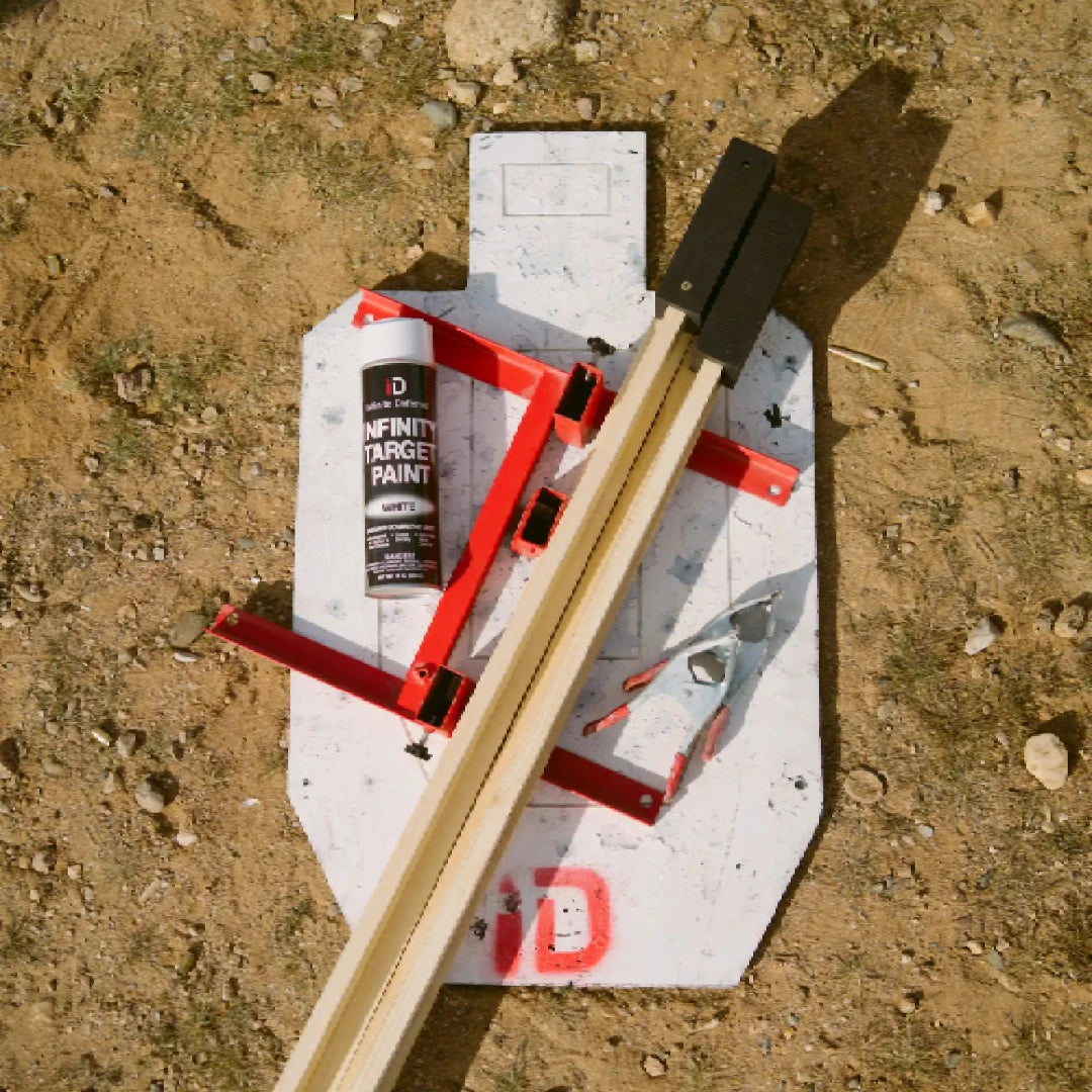 Shooting target with stand and paint can on a dirt ground
