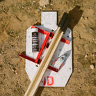 Shooting target with stand and paint can on a dirt ground