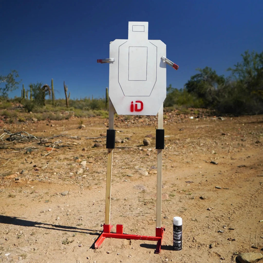 White target with red 'id' logo on a stand in an outdoor setting