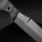 Close up of Dynamis x Winkler DYNAMIS double edge 80CRV2 combat knife showing blade grind and precision thumb ramp jimping