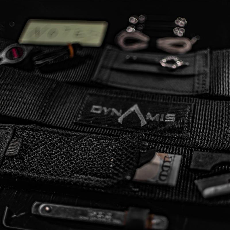 Dynamis Alliance LOPRO Belt displayed with everyday carry gear, highlighting concealed storage options for small tools and essential items.