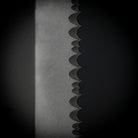 Spine and serration detail of the Dynamis Neptune IWB Kit blade highlighting partial serrations and NEPT-X proprietary coating for extreme corrosion resistance in marine or sweaty environments.