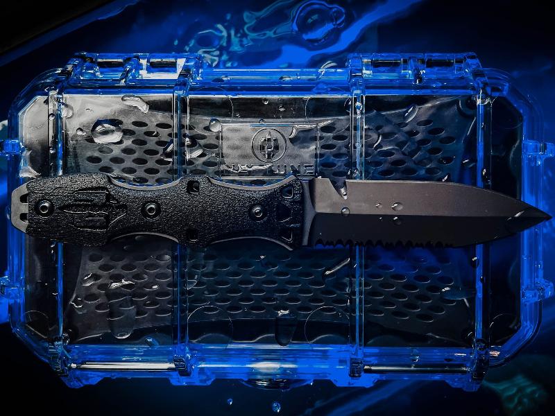 Dynamis Neptune IWB corrosion resistant combat knife resting on included waterproof protective case with IWB sheath and line cutter visible