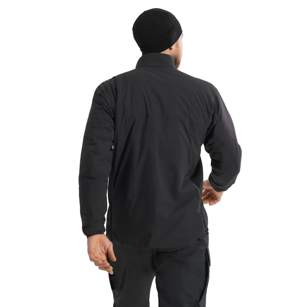 Rear view of Arc'teryx PRO Atom LT Jacket Gen 2.1 in Black being worn in the field, lightweight tactical insulated mid layer with articulated fit and breathable stretch panels designed for professional military and law enforcement operations