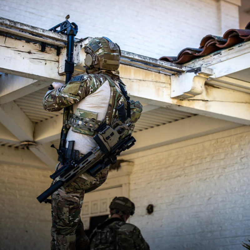 Operator wearing plate carrier equipped with Ferro Concepts 3AC Side Plate Pockets 6x6 demonstrating side armor integration during training and field operations