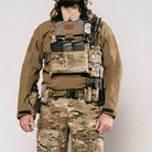 Operator wearing a plate carrier equipped with the Ferro Concepts ADAPT Kangaroo Front Flap configured with mission-essential pouches and equipment.