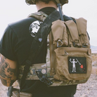 Ferro Concepts Back Panel Banger mounted on operator loadout carrying magazines and mission essential equipment in rear panel storage pockets