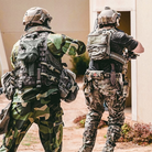 Operators wearing plate carriers with Ferro Concepts Back Panel Double Pouch demonstrating expanded rear storage and modular loadout capability