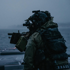 Operator equipped with Ferro Concepts Back Panel Double Pouch during field operations showing scalable rear storage for mission essential gear
