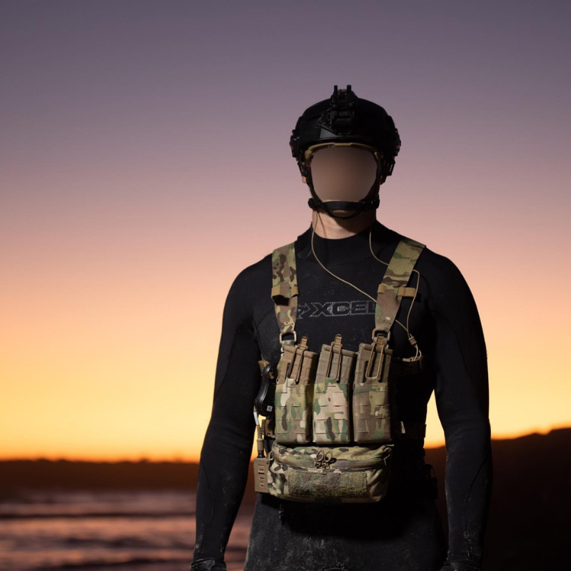 Operator wearing a Ferro Concepts Chesty Rig Mini Harness configured with mission-essential equipment during low-light field operations.