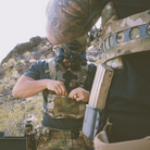 User operating a rifle while wearing a Ferro Concepts Chesty Rig Mini Harness configured for tactical training and mission-specific gear carry.
